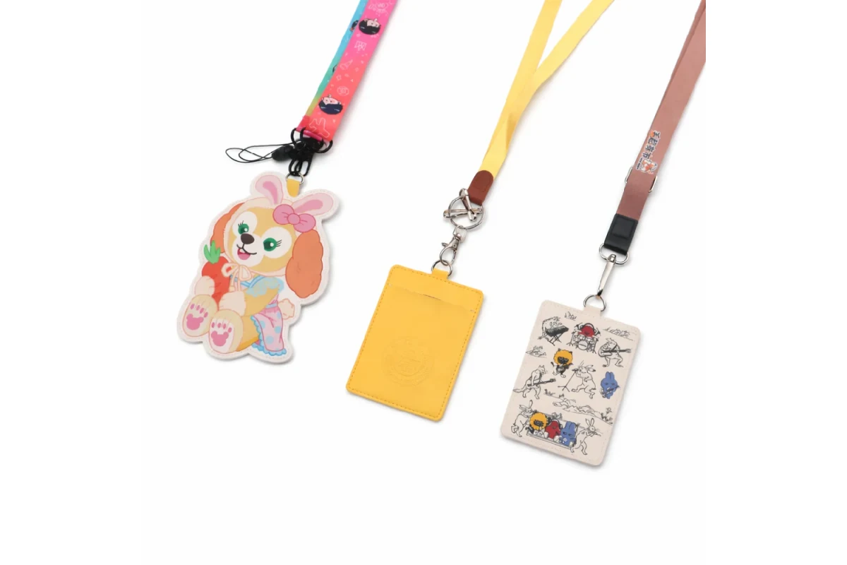 Three card holders with different lanyards and metal or plastic connectors